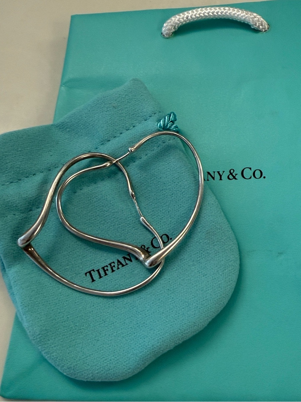 Large Elsa Peretti Tiffany & Co open heart sterling silver earrings.